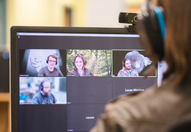 Photo of various team members on a video call